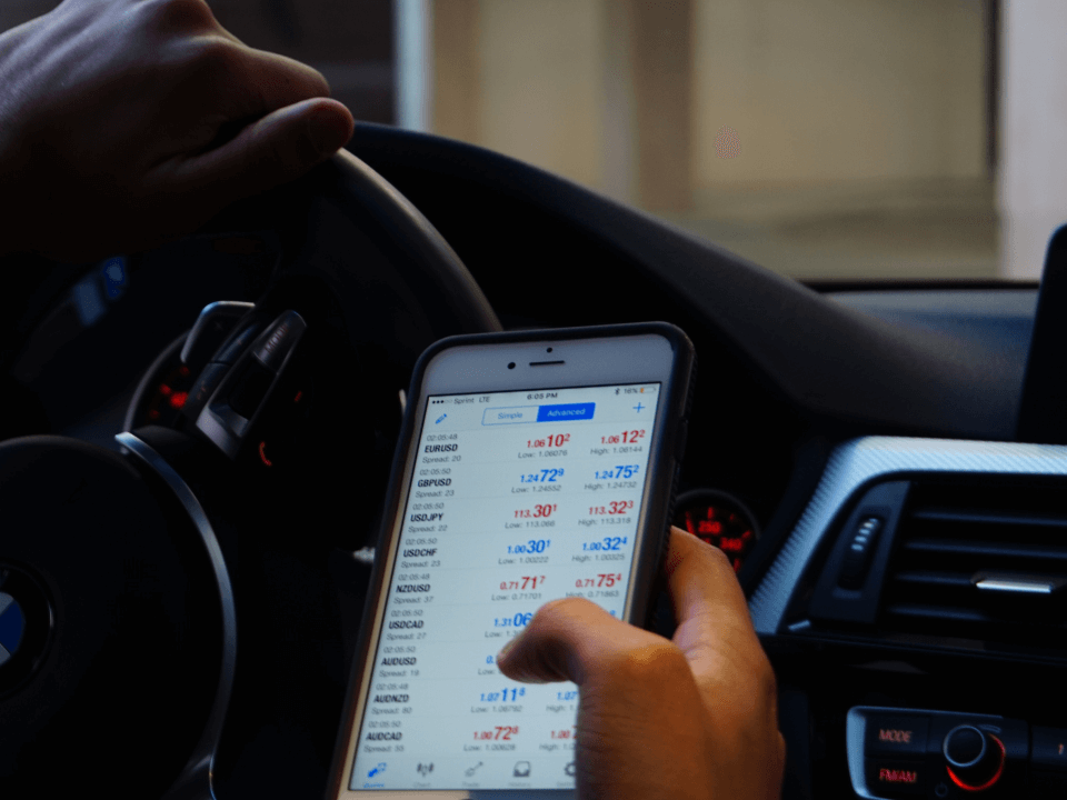 A Person Checking The Stock Market On Their Smartphone