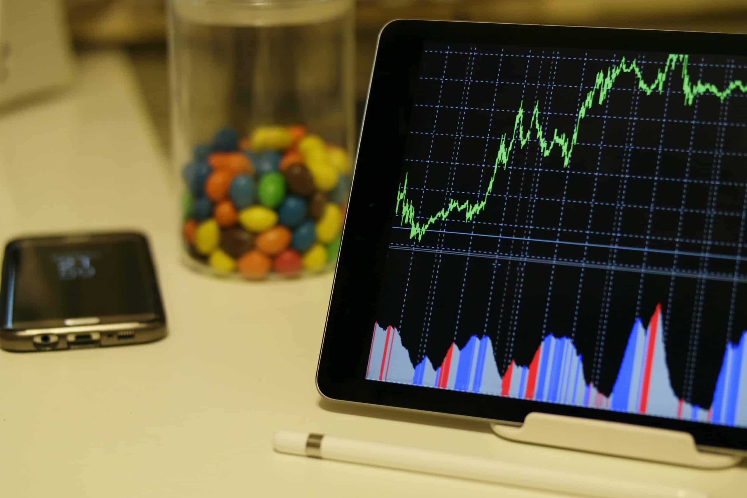 tablet on table showing stock chart