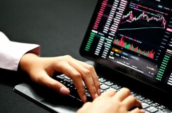 dark laptop screen showing a trading chart