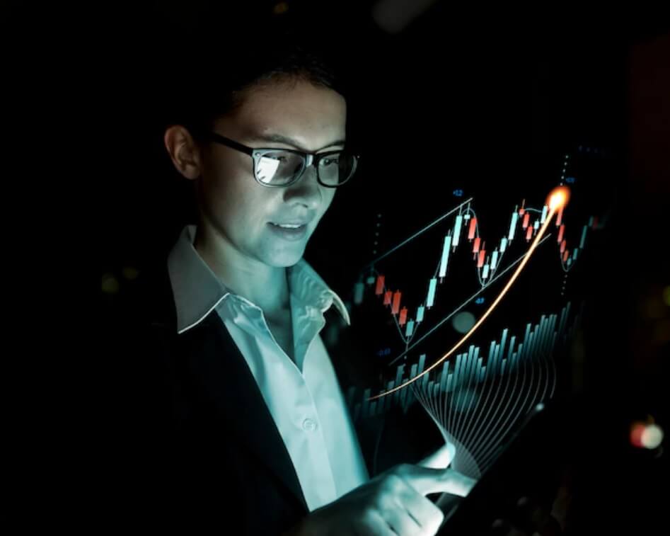 woman with glasses pointing at forex chart