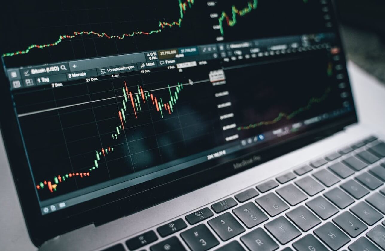 close up of laptop screen showing trading chart