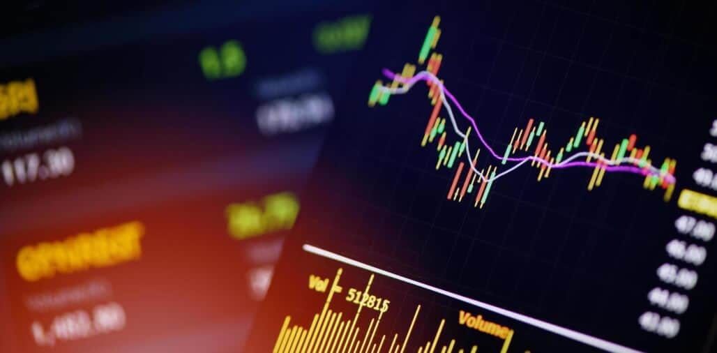 phone and laptop showing forex chart
