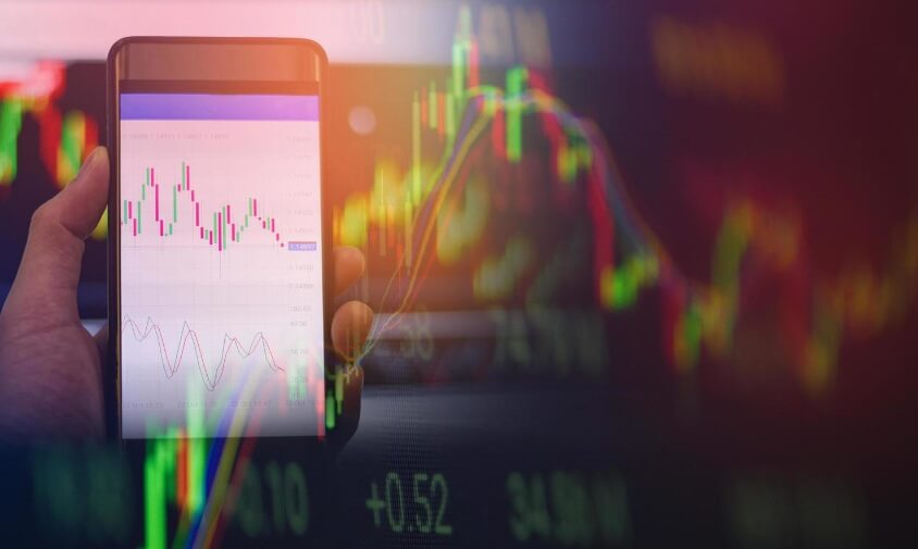 hazy virtual forex chart in front of laptop