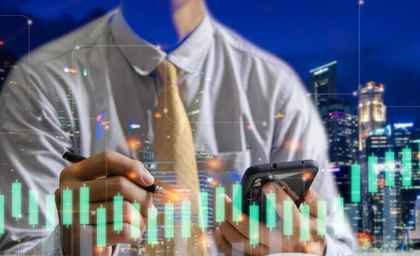 man holding phone with forex chart overlay