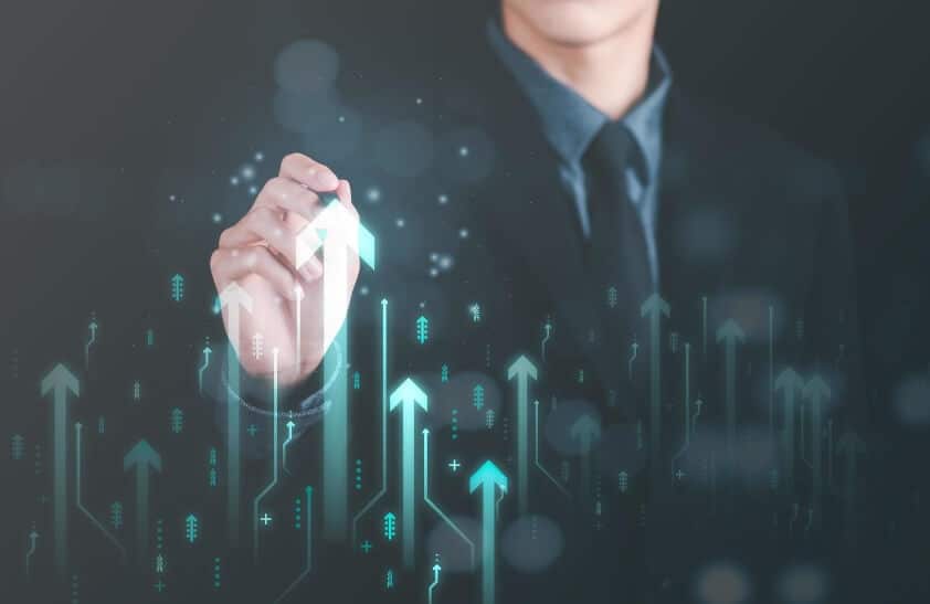 hand showing upward movement on overlay finance chart