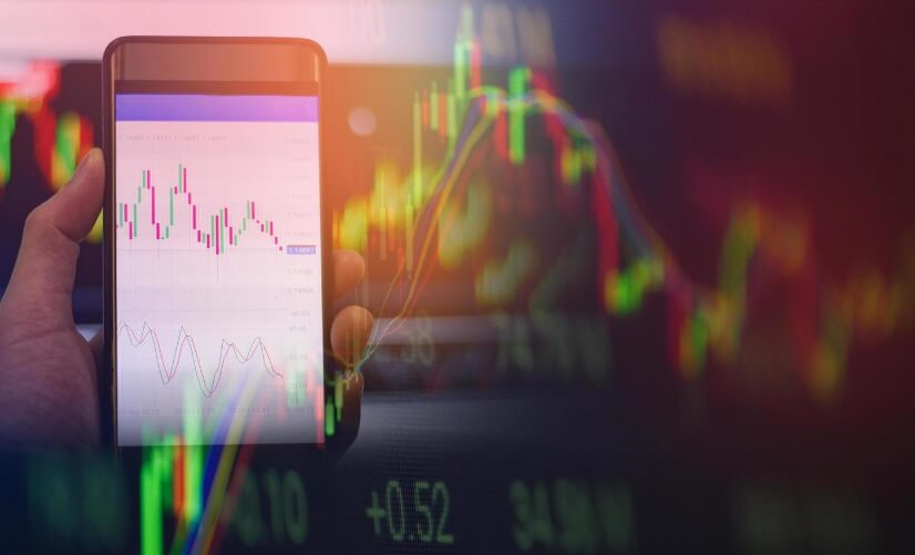 overlay of forex chart with phone showing trading chart