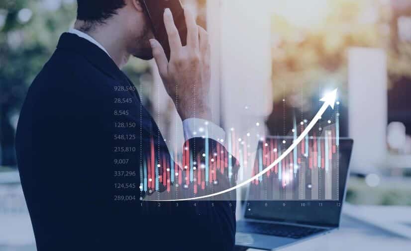 man holding phone with forex chart overlay