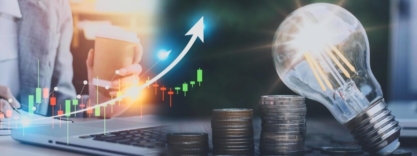 coins next to laptop showing forex trading chart with overaly