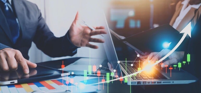 man going over data with forex chart overlay