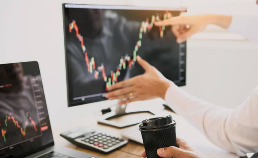 hand moving over screen showing forex chart