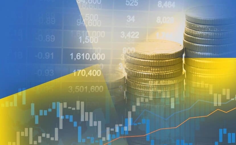 coins mixed with blue and yellow forex chart