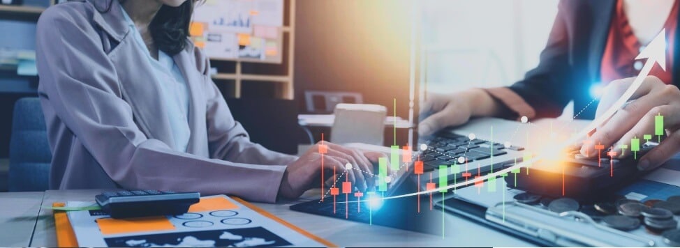 man typing on keyboard with forex chart overlay