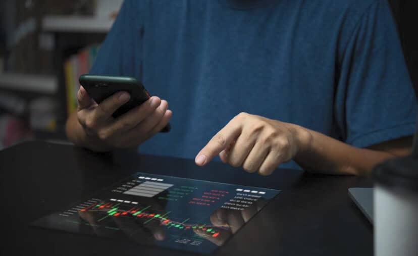 man pushing finger on virtual forex chart