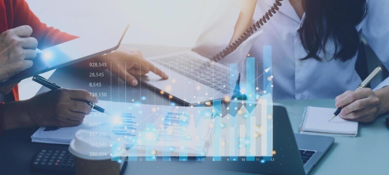 forex chart with people working in background