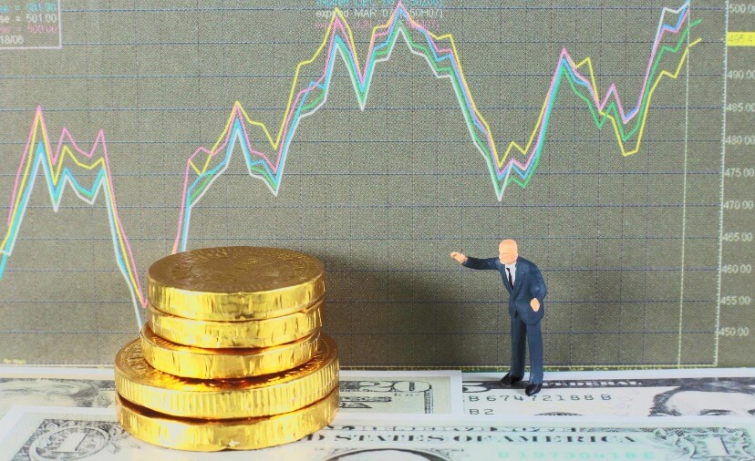 large coins, small man, forex chart